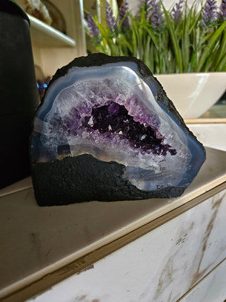 Amethyst Geode with on a marble surface

CHIQUE Rock Shop 