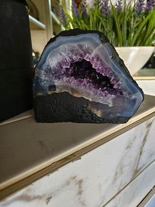 Amethyst Geode with on a marble surface

CHIQUE Rock Shop 
