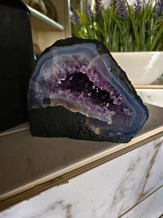 Amethyst Geode with on a marble surface

CHIQUE Rock Shop 