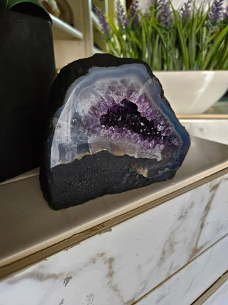 Amethyst Geode with on a marble surface

CHIQUE Rock Shop 