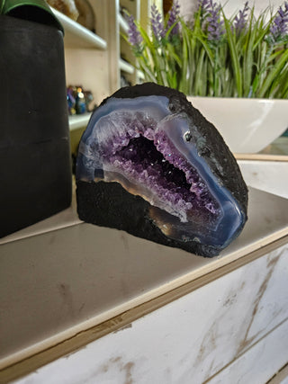 Amethyst Geode with on a marble surface

CHIQUE Rock Shop 
