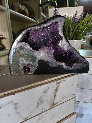 Amethyst Geode looks like a dolphin.  Lovely piece.

CHIQUE Rock Shop 
