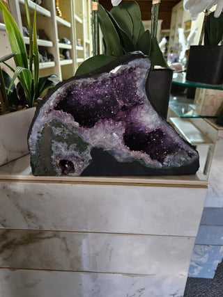 Amethyst Geode looks like a dolphin.  Lovely piece.

CHIQUE Rock Shop 
