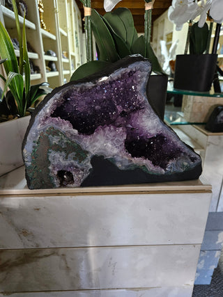 Amethyst Geode looks like a dolphin.  Lovely piece.

CHIQUE Rock Shop 

