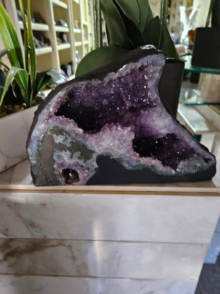 Amethyst Geode looks like a dolphin.  Lovely piece.

CHIQUE Rock Shop 