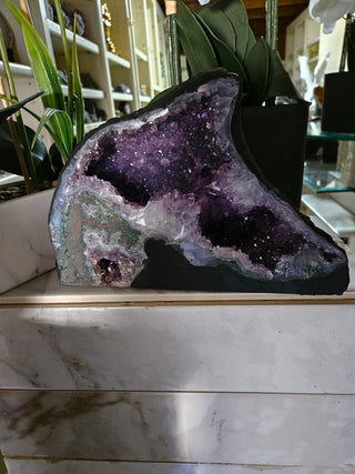 Amethyst Geode looks like a dolphin.  Lovely piece.

CHIQUE Rock Shop 