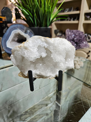 Clear Quartz Geode on Black Metal Stand

CHIQUE Rock Shop