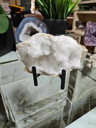 Clear Quartz Geode on Black Metal Stand

CHIQUE Rock Shop