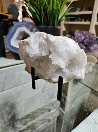 Clear Quartz Geode on Black Metal Stand

CHIQUE Rock Shop