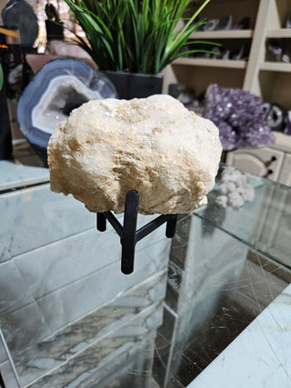 Clear Quartz Geode on Black Metal Stand

CHIQUE Rock Shop