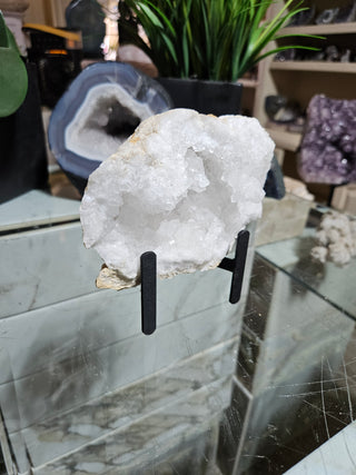 Clear Quartz Geode on Black Metal Stand

CHIQUE Rock Shop