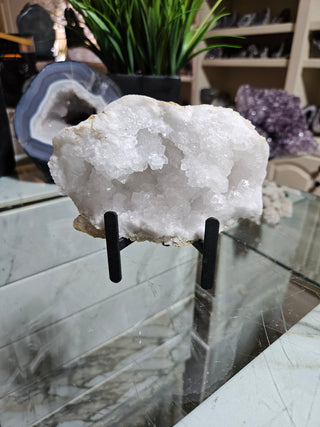 Clear Quartz Geode on Black Metal Stand

CHIQUE Rock Shop
