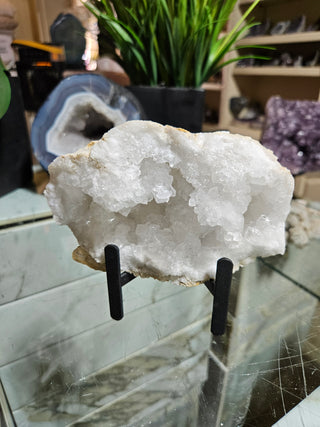 Clear Quartz Geode on Black Metal Stand

CHIQUE Rock Shop