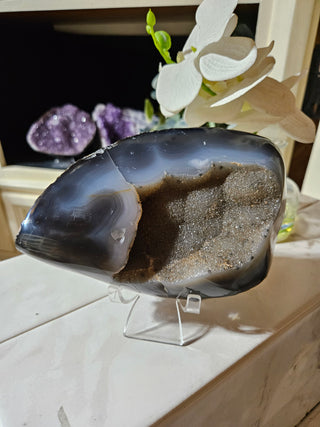 Agate crystal on a clear stand

CHIQUE Rock Shop