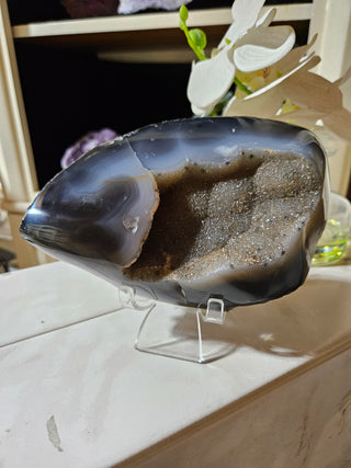 Agate crystal on a clear stand

CHIQUE Rock Shop
