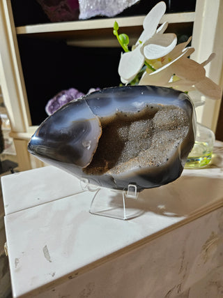 Agate crystal on a clear stand

CHIQUE Rock Shop