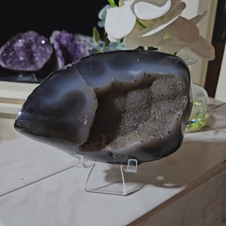 Agate crystal on a clear stand

CHIQUE Rock Shop