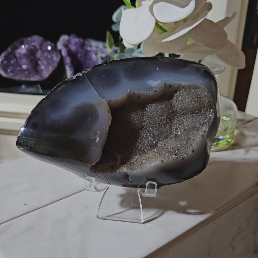 Agate crystal on a clear stand

CHIQUE Rock Shop