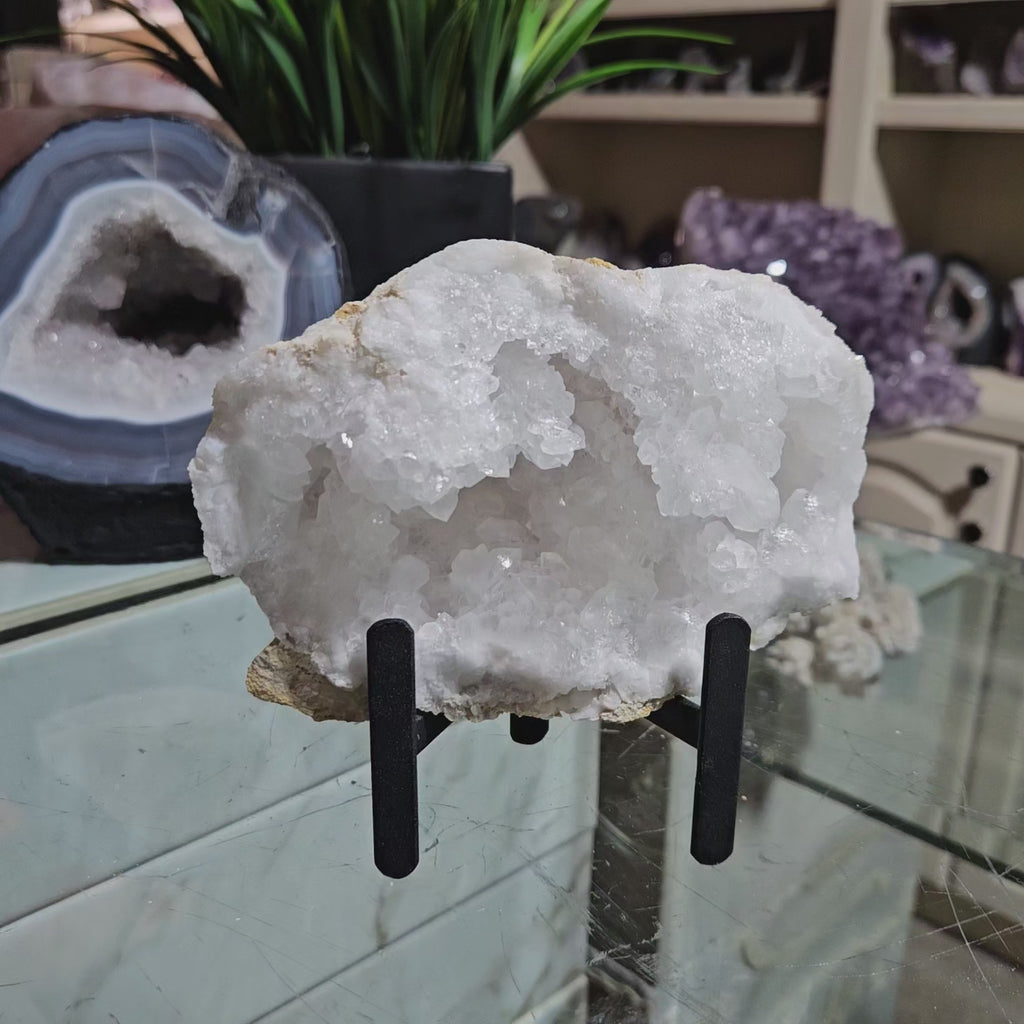 Clear Quartz Geode on Black Metal Stand

CHIQUE Rock Shop